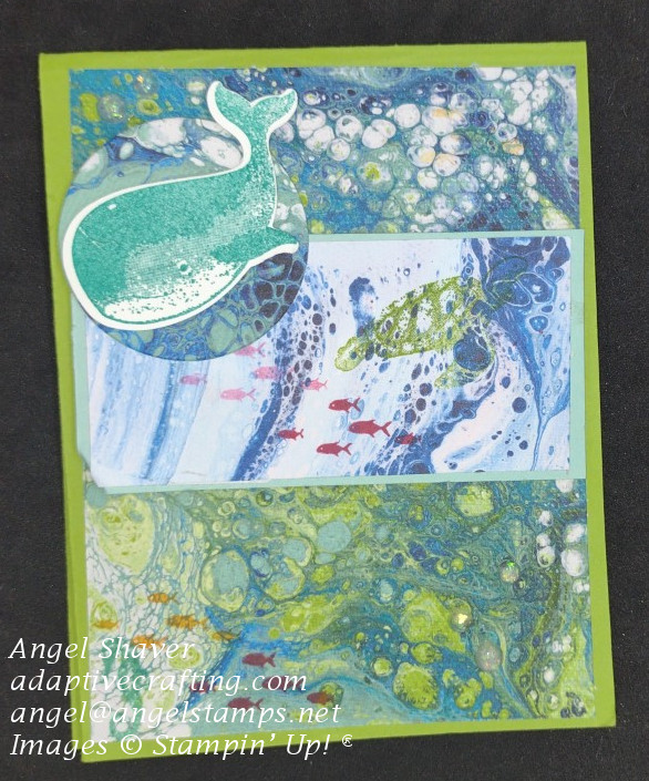 Green card with patterned paper representing the ocean with stamped sea creature swimming in the ocean.