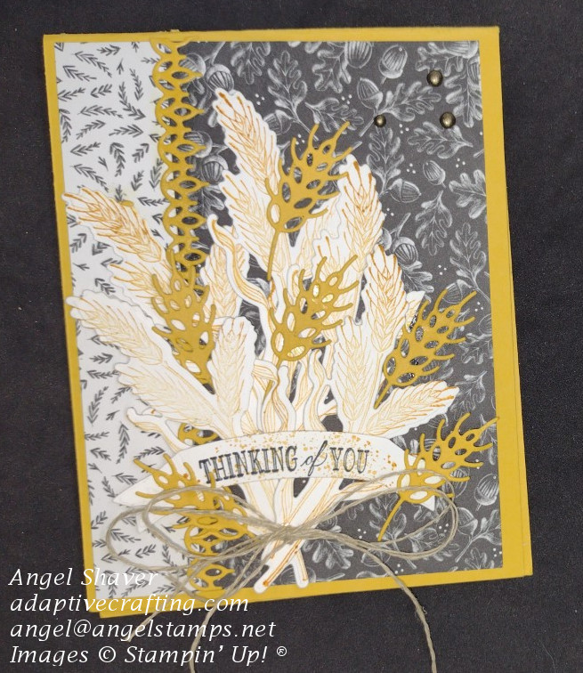 Yellow card with harvest black and white patterned background paper.  Bouquet of both stamped and detailed wheat dies featured on card front with "thinking of you" label.
