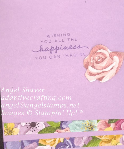 Inside of card with pink die cut rose and strips of multi-colored floral paper with sentiment that says, "Wishing you all the happiness this day brings"