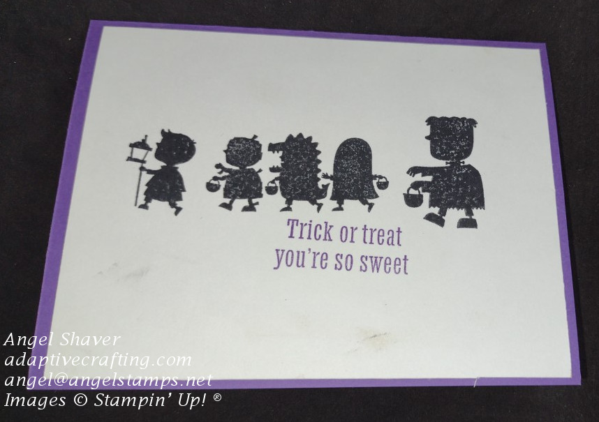 Card featuring silhouette of parade of kids wearing costumes.  Card base and sentiment are purple.  Sentiment says "Trick or treat. You're so sweet."