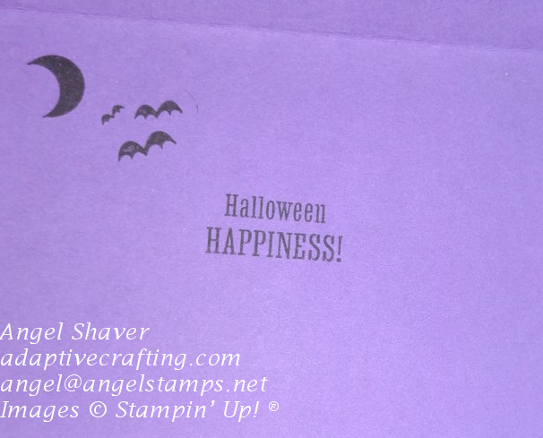 Inside of purple card with black stamped moon, bates, and sentiment that says, "Halloween Happiness."