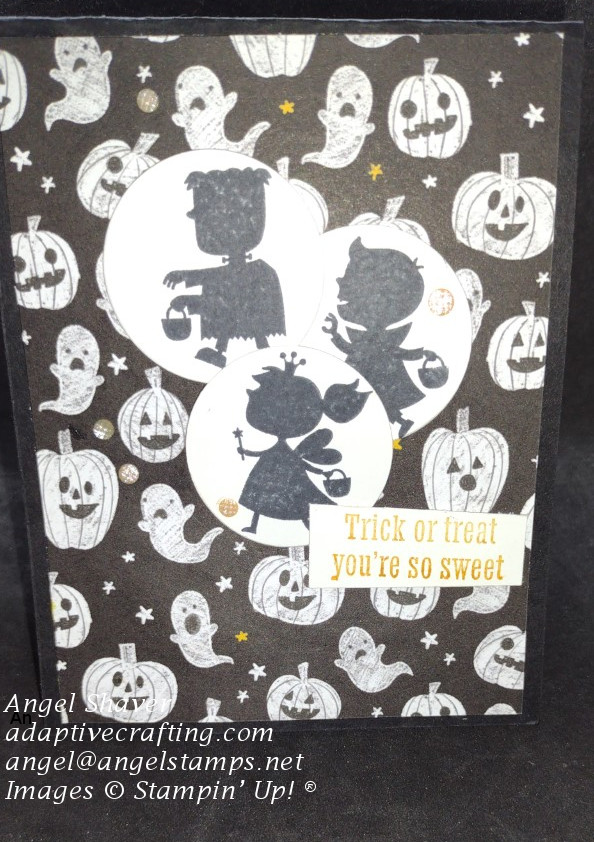 Black Halloween card with background paper with jack-o-lanterns and ghosts.  Card features three circles with stamped kids in costumes.  Sentiment says "trick or treat."