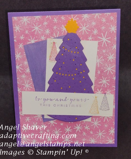 Purple Christmas card with pink background with white starbursts.  Featured purple Christmas tree with mango die shining through as lights on the tree.  Sentiment says "for you and yours this Christmas."