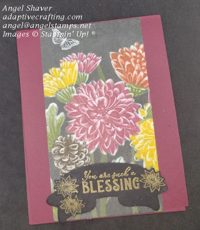 Reddish card with strip of patterned paper featuring fall flowers and a butterfly.  Sentiment label says "You are such a blessing" and is heat embossed in gold on black paper with three small flowers surrounding the sentiment.