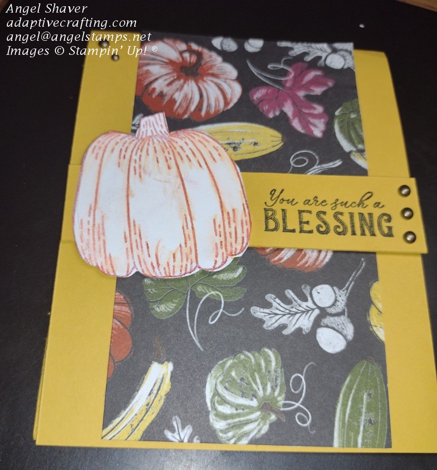 Yellow card with panel of patterned paper with fall produce and leaves on center of card front.  Yellow cardstock strip runs horizontally and says, "You are such a blessing." with pumpkin die on front.