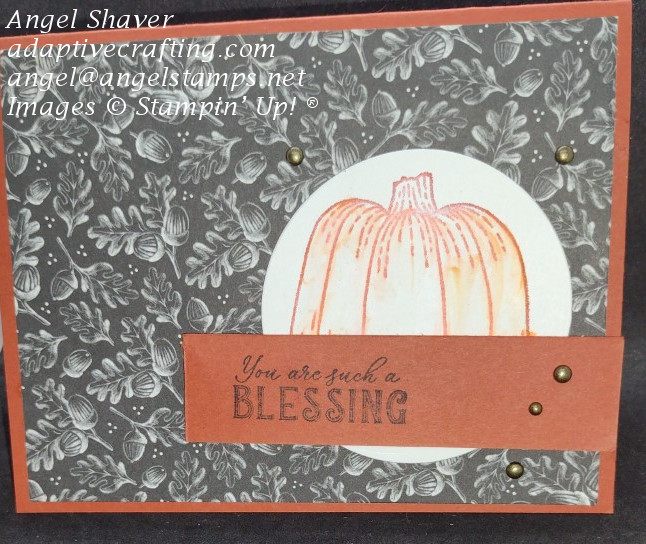 Cajun craze fall card with black and white patterned paper layer with acorns and oak leaves.  Featured stamped pumpkin.  Sentiment strip says "You are such a Blessing."