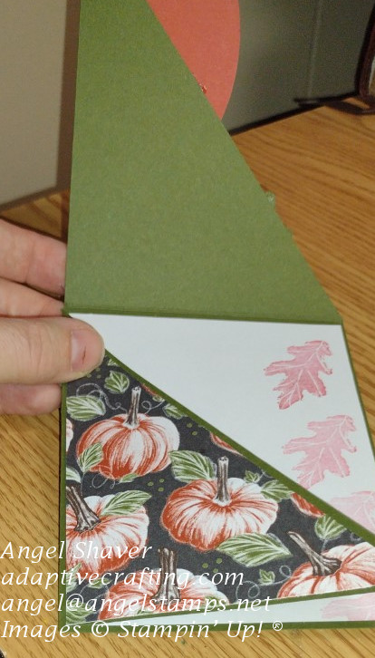 Green double diagonal card with one flap open.  Other flap has pumpkin patterend paper.