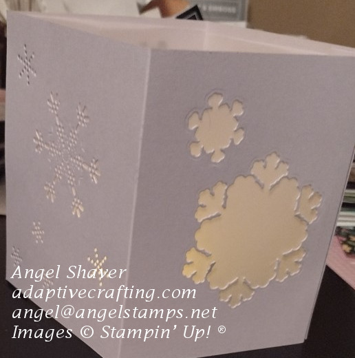 Light purple luminary with snowflake dies covered in vellum.