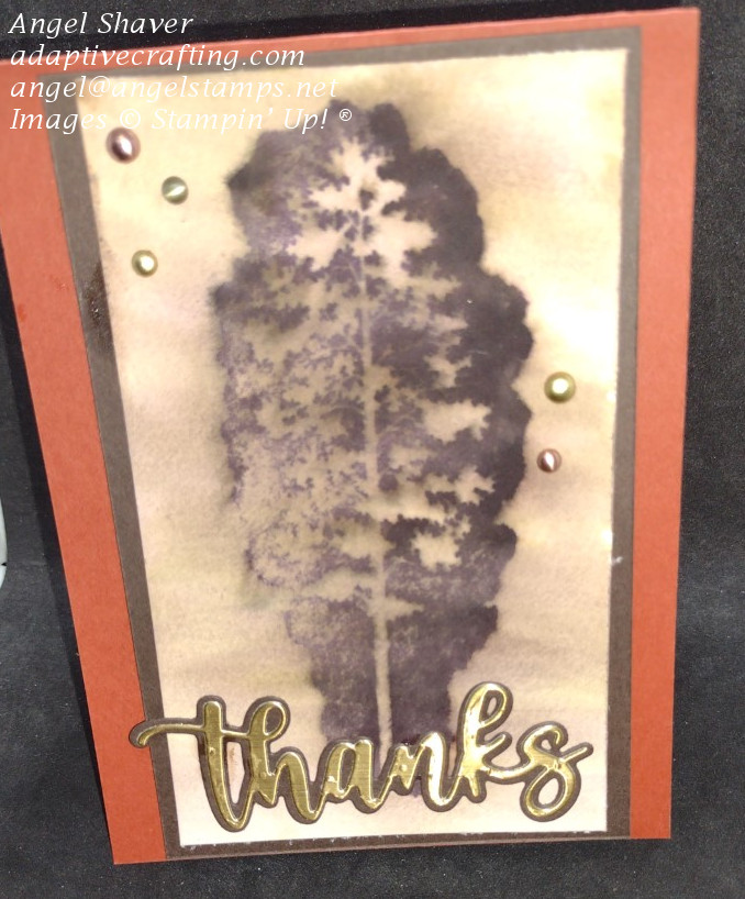 Deep orange thank you card with woodburning technique dark brown stamped tree on front with thanks die at bottom of card.