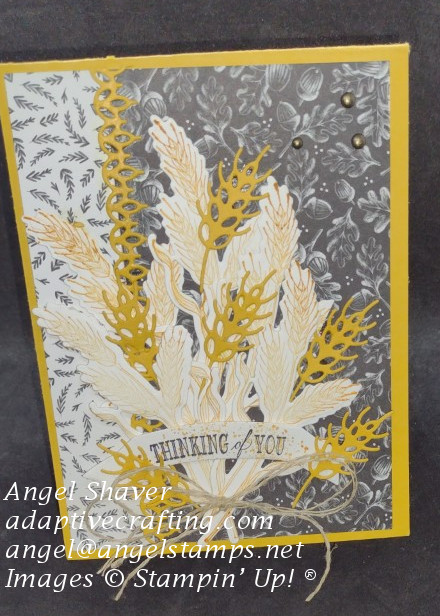 Yellow card with harvest black and white patterned background paper.  Bouquet of both stamped and detailed wheat dies featured on card front with "thinking of you" label.
