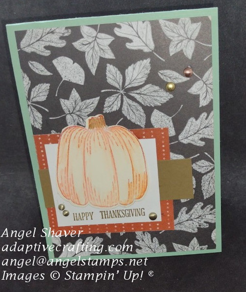 Mint Thanksgiving card with autumn leaf background paper.  Card features a pumpkin die and the sentiment, "Happy Thanksgiving."