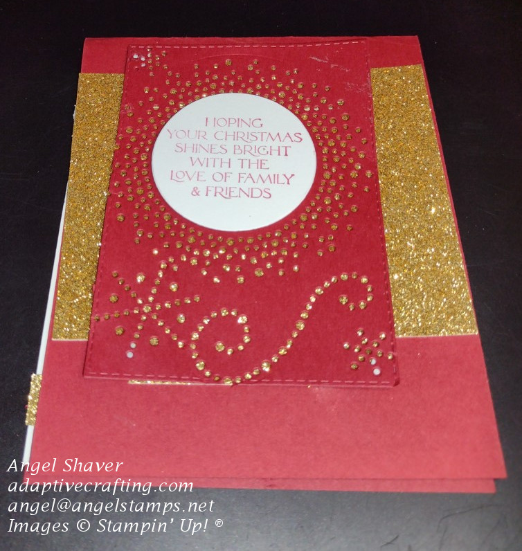 Red Christmas card with gold glimmer paper and a red rectangle on top.  The gold glimmer paper shines through the die cut images.  Sentiment says, "Hoping your Christmas shines bright with the love of family and friends."