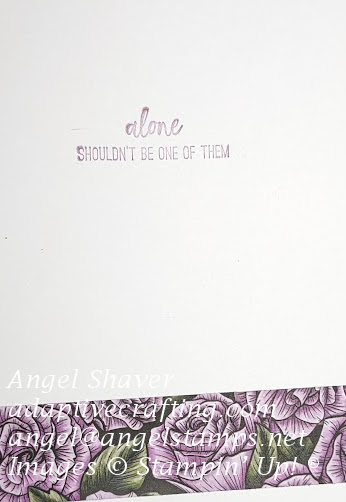 Inside of card with strip of patterned paper with purple flowers at bottom of card.  Sentiment ways "alone shouldn't be one of them."