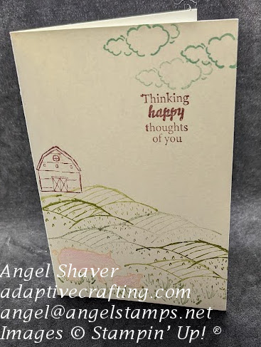 White notecard with farm scene stamped with barn, rolling hills, and pigs.  Sentiment says "Thinking happy thoughts of you."