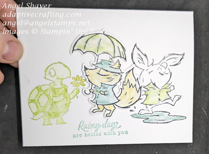 White #simple stamping card with turle, fox, and rabbit playing in the rain.  Sentiment says, "Rainy days are better with you."