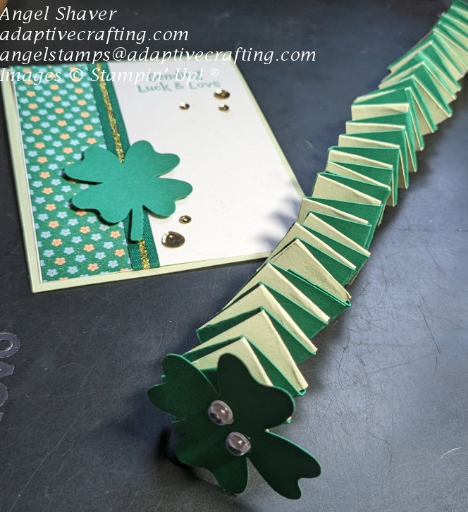 Green St. Patrick's Day card with four-leaf clover punch.  Coordinating paper snake with lucky clover head.