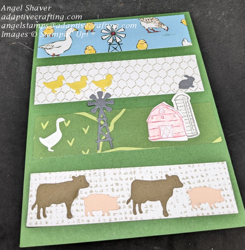 Green card with four strips of DSP with different farm animals or buildings on them.  Miniature animals on the patterned paper or die cuts.