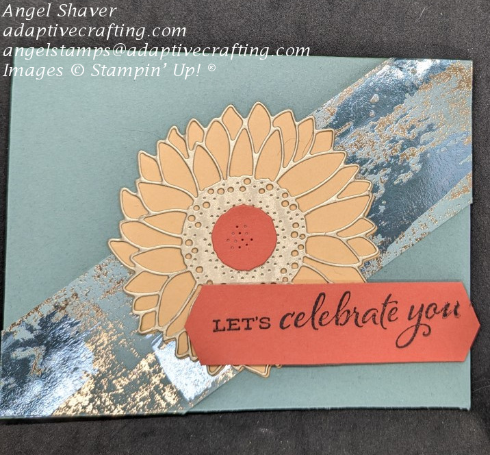 Green card with diagonal strip of green and gold specialty paper across middle.  Sunflower die is popped up on center front.  Sentiment label says, "Let;s celebrate you."