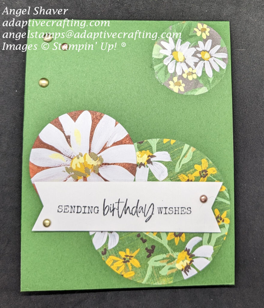 Green card with three different size circles of daisy patterned paper.  Sentiment says, "sending birthday wishes" Decorated with brushed metallic dots.