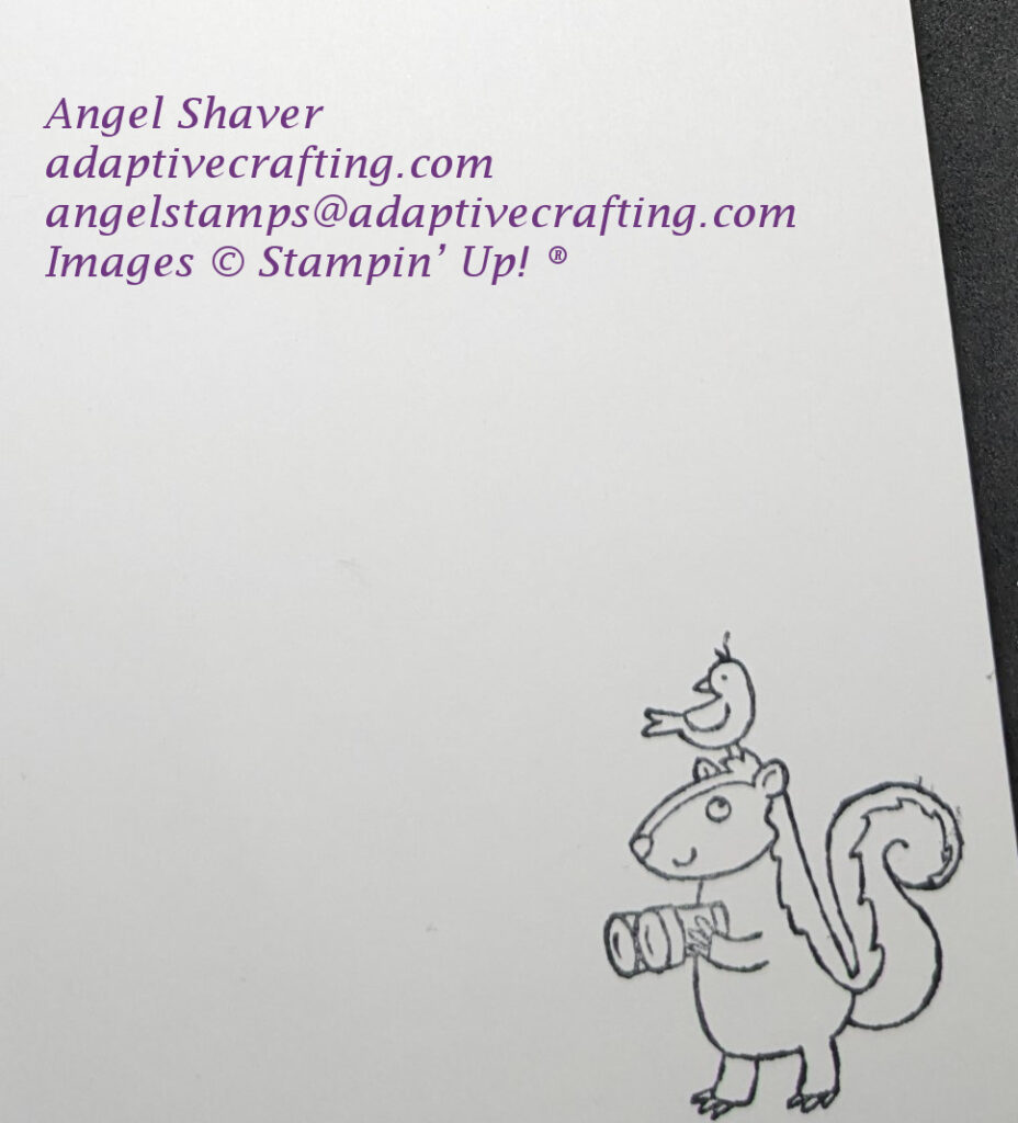 Inside of card with stamped skunk holding binoculars with a bird on his head.