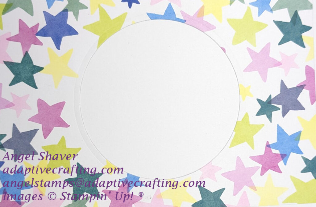 Inside of card with bright stars surrounding white circle in the center of card.