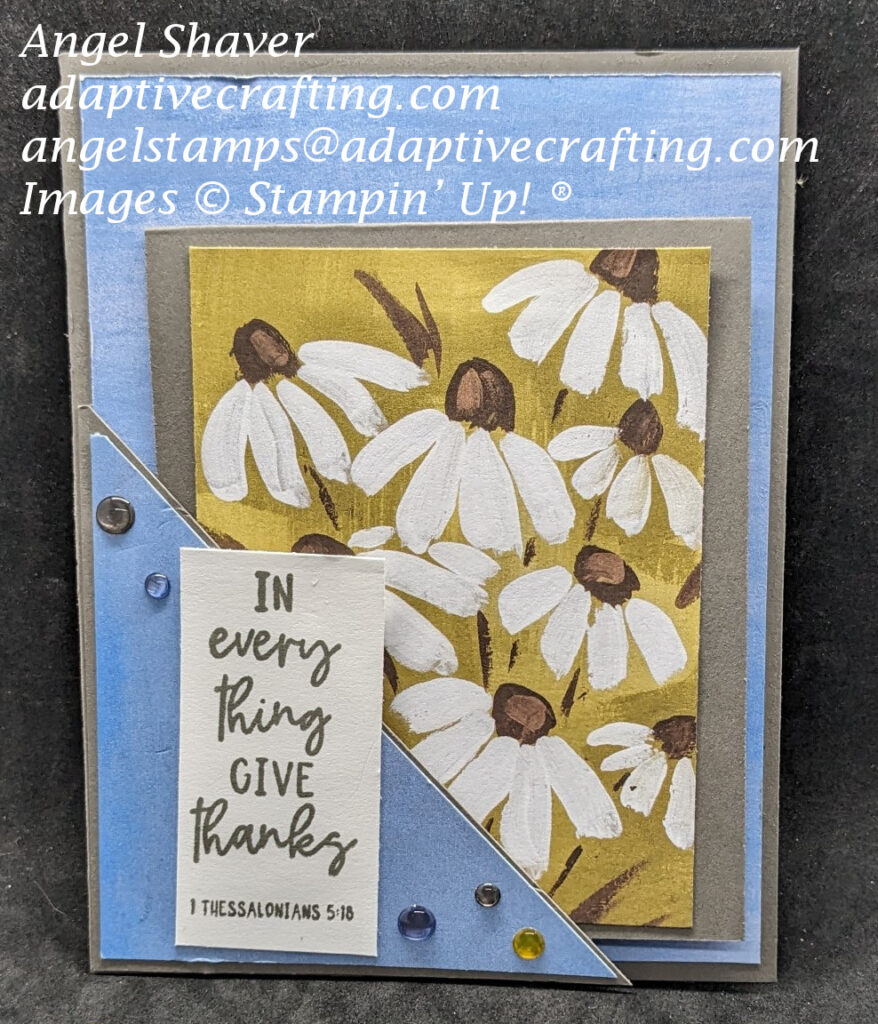 Gray pocket card with blue patterned paper.  Smaller card tucked in the pocket is gray with a pattered paper panel on the front with daisies.  Sentiment label on pocket says, "In everything give thanks.  I Thessalonians 5:18"