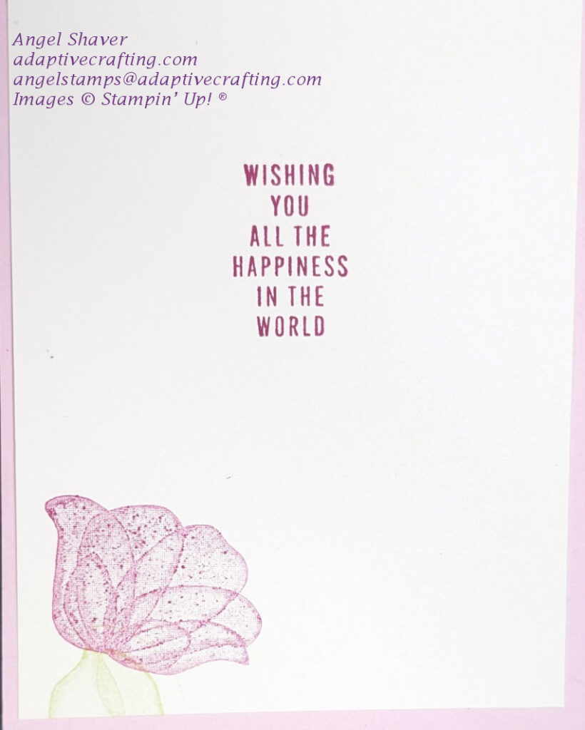 Inside of card with stamped pink flower with green leaves at bottom left corner.  Sentiment says, "Wishing you all the happiness in the world."