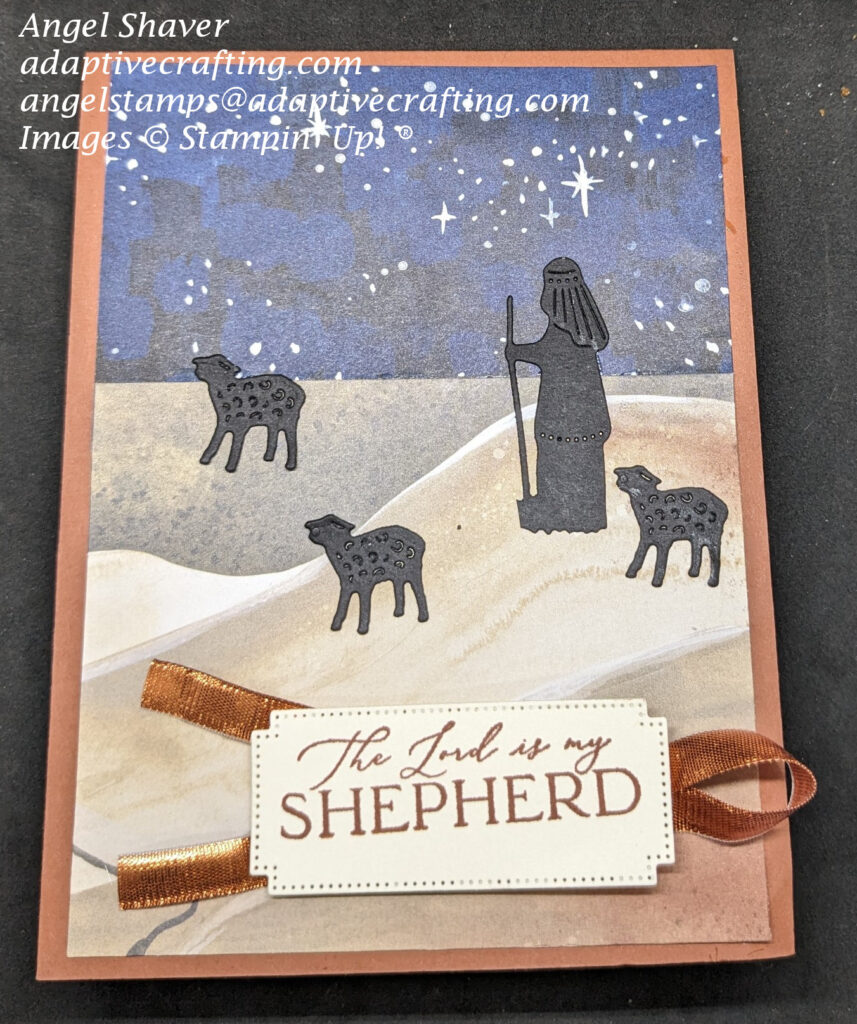 Brown Christmas card with patterned paper showing a desert scene under a night sky filled with stars.  A shepherd die cut and three sheep are standing in the desert.  The sentiment says, "The Lord is my Shepherd."