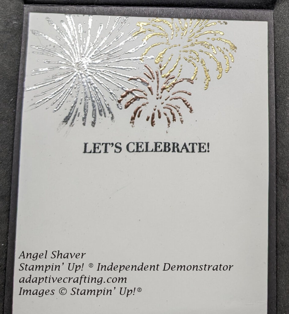 White inside of card with silver, gold, and copper heat embossed fireworks.  Sentiment says, "Let's Celebrate"