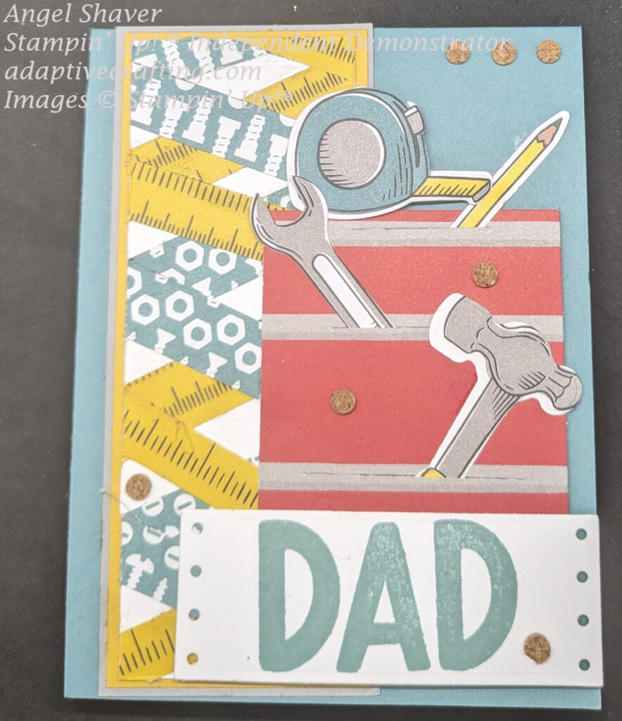Teal Father's Day card with double twisted ribbon embellishment on the left side of the card featuring patterned paper that looks like measuring tape and has images of screws on it.  Right side of card front has red tool chest with tools sticking out of drawers: hammer, wrench, pencil.  There is a measuring tape on top.  Label at bottom of tool chest says "DAD"