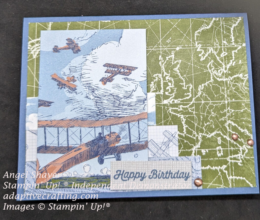 Blue card with green map background paper.  Topped with three strips of patterned paper--clouds, airplanes, topical map.  Printed rectangle with several vintage planes flying through the clouds on top.  Sentiment strip says "Happy Birthday."