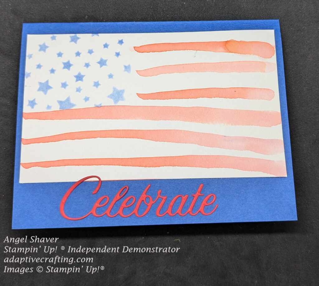 Blue card with flag created on watercolor paper. Blue stars in upper left corner created with a stencil.  Red stripes are added by watercoloring.  Red word die "Celebrate" added to bottom of card.