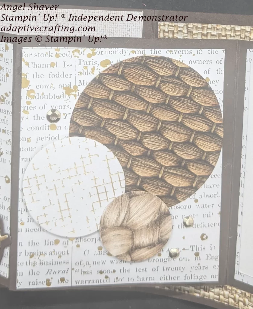 Center panel of smaller front Z on the card. Background paper with type and the look of gold splatter. On top of that are circles in different sizes with different woven textures or checked gold foil. The panel is decorated with gold enamel dots.