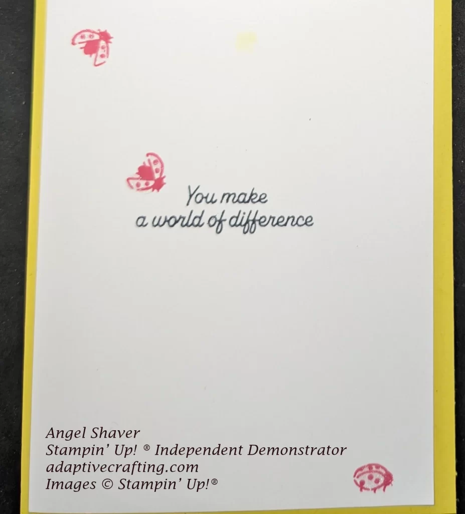White inside of card with stamped ladybugs and sentiment that says, "You make a world of difference."