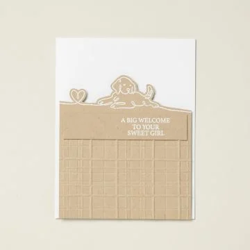 White card with brown cardstock embossed with plaid embossing folder. Dog and line with heart stamped at top of brown paper and heat embossed in white. Sentiment heat embossed in white.