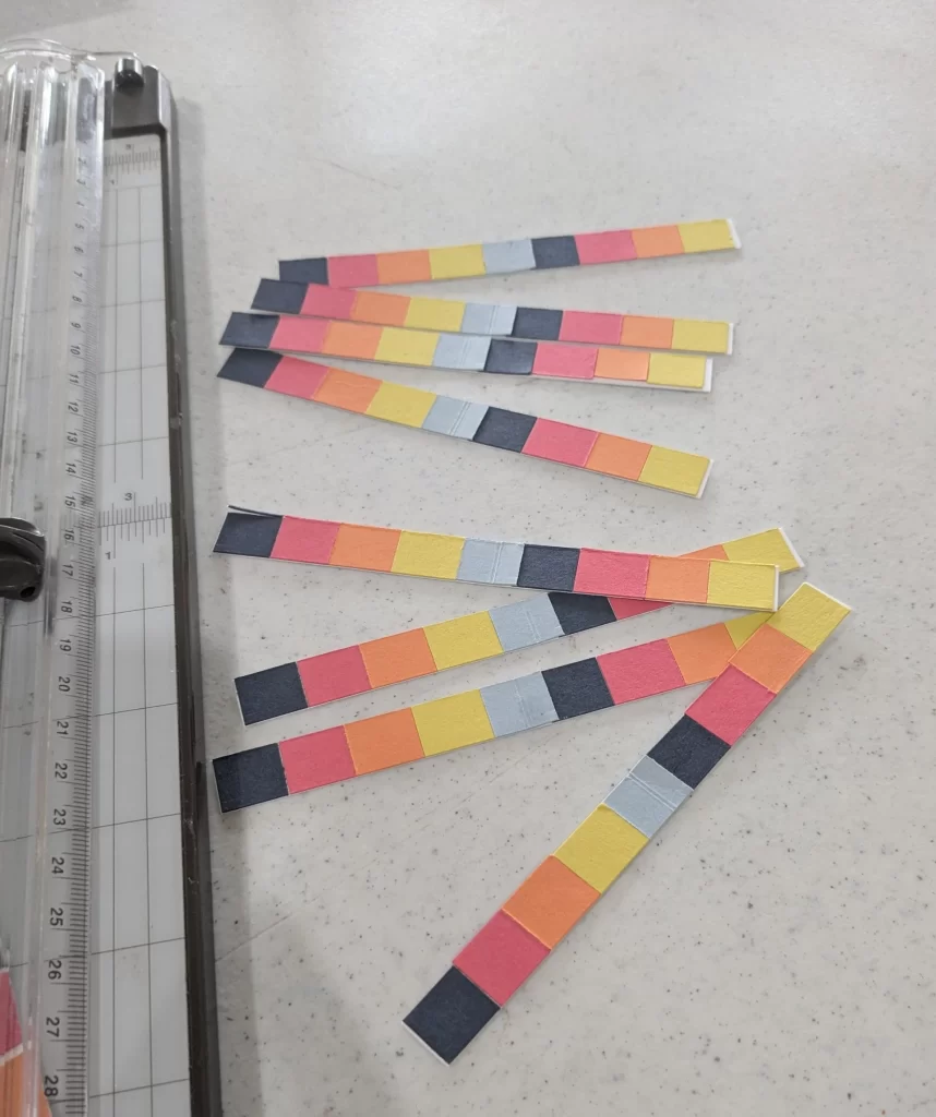 Strips of small squares of alternating 2026-2027 In Colors sized to be used on the inside of cards.