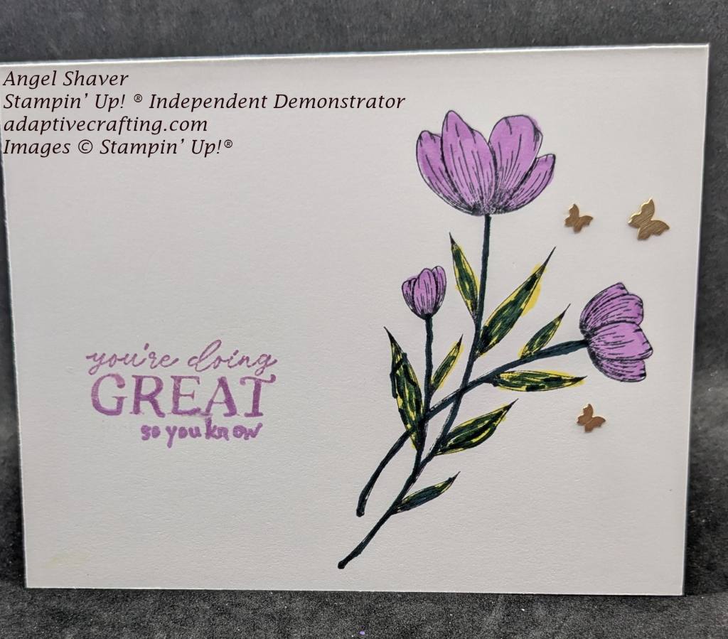 White card with purple flowers stamped on right side with butterfly embellishments around.  Sentiment stamped on left side, "You're doing great so you know."