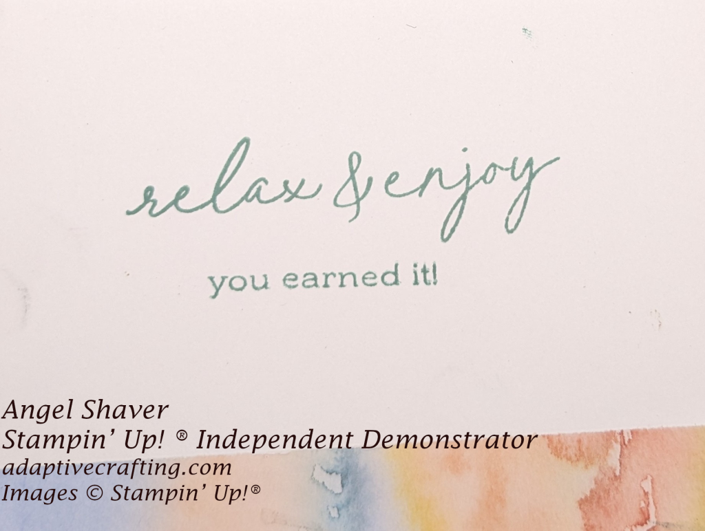 White inside of card with strip of patterned paper in watercolor swirls in purple, blue, orange, and red  Sentiment says, "relax and enjoy.  You earned it."