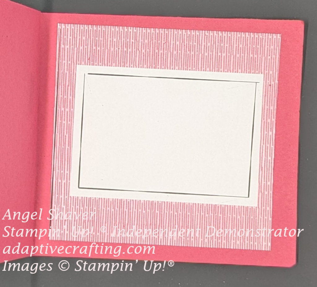 Red card inside with piece of red and white striped patterned paper with a white rectangle in the center.