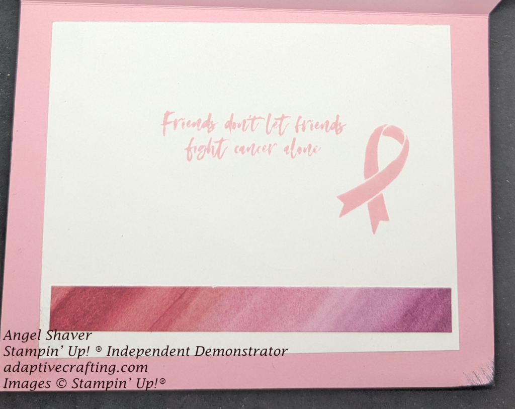 Pink  card with white cardstock inside.  Strip of patterned paper with pink diagonal stripes adhered across bottom.   "Friends don't let friends fight cancer alone" and pink support ribbon stamped in the center.