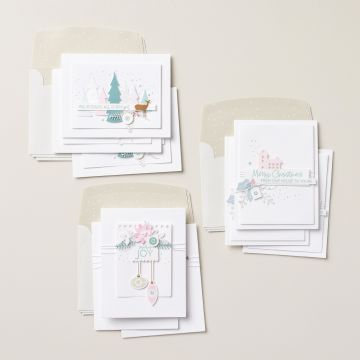Photos of all 3 card designs from the Cozy & Bright kit with diecut trees, ornaments, branches in shades of teal, pink, and white.