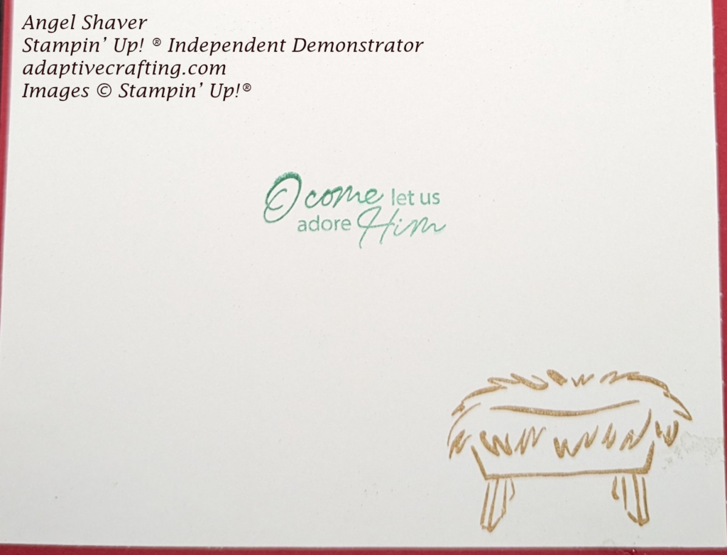 White inside of card with manger stamped in brown.  Sentiment stamped in green that says, "O come let us adore Him"