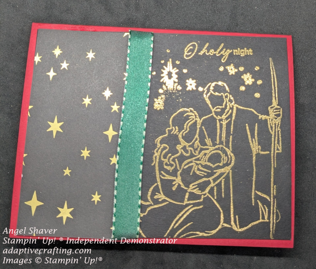 Red card with black card front.  Left side is patterned paper with gold stars.  Right side is gold heat embossed Holy Family, stars, and sentiment that says, "O holy night."  Green ribbon runs down the side of the patterned paper.