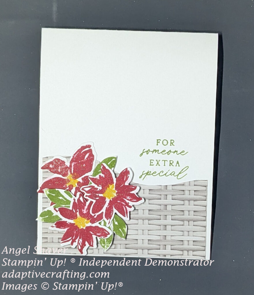 White card with woven patterned paper at the bottom of the front. Red flowers and green leaves are the focal image. Sentiment stamped says, "For someone extra special"