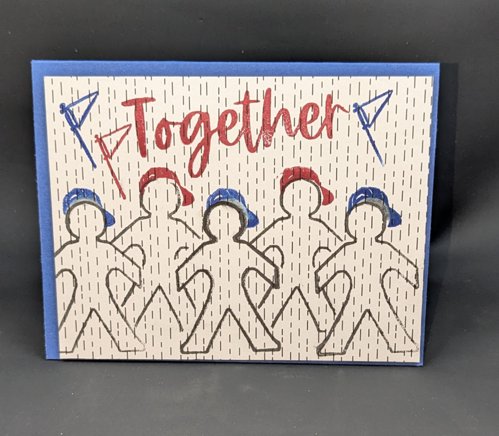 Blue card with a white patterned paper layer with black dotted lines.  Five figures are stamped directly on the card with red or blue ball caps.  The top of the card says, "Together" and there are red and blue stamped pennants.